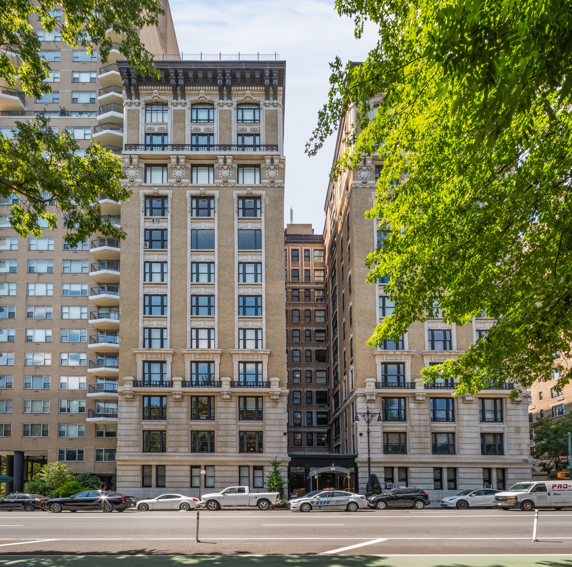 The Brentmore's full limestone and brick façade seen from across Central Park West
